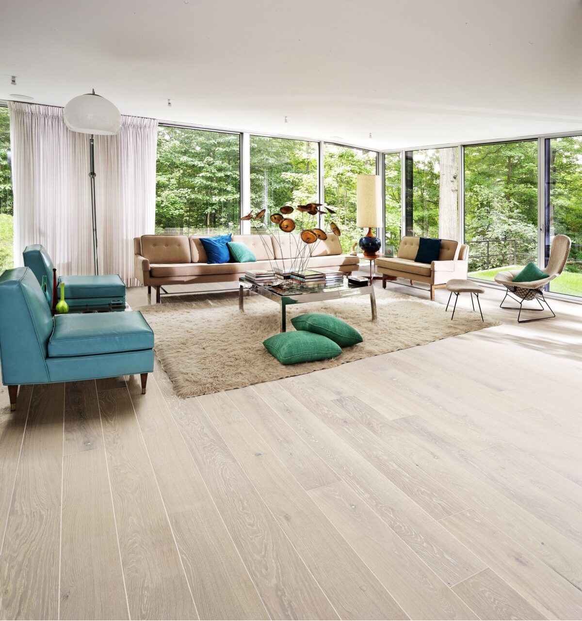 Decorated indoor room with natural lighting and Kahrs Oak Nouveau Snow Prefinished Hardwood.