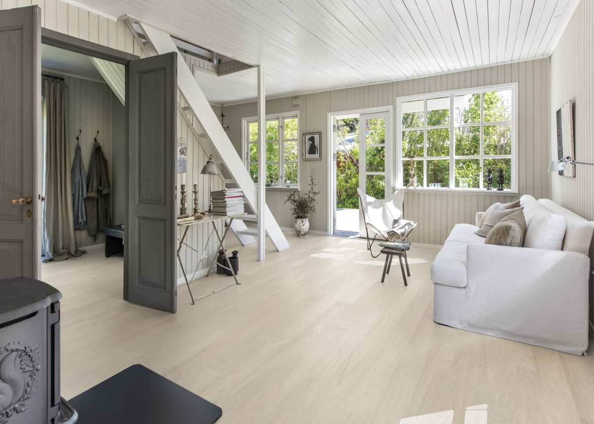 Decorated living room with Kahrs Coconut Cream Wide Prefinished Hardwood.