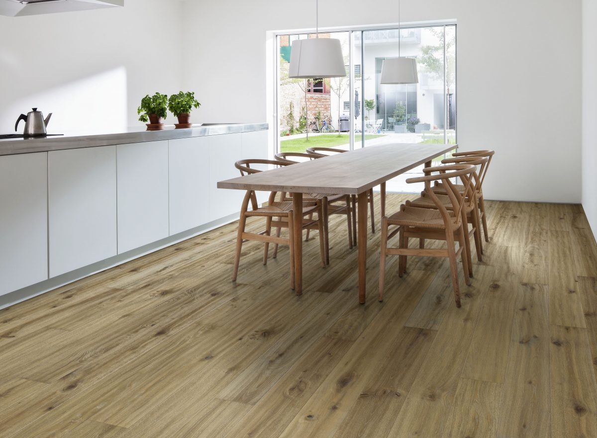 Decorated dining space with Kahrs More Prefinished Hardwood.