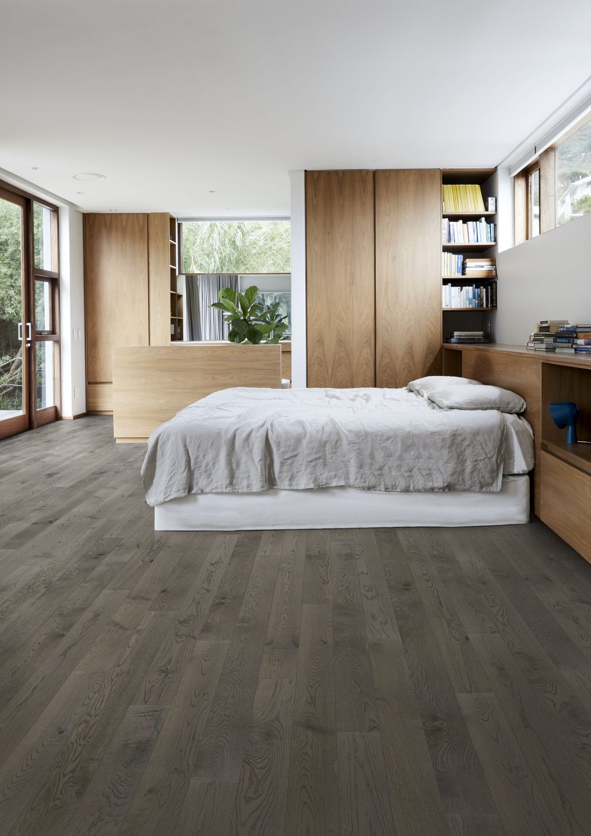 Decorated bedroom space with Kahrs Oak Carbon Prefinished Hardwood.