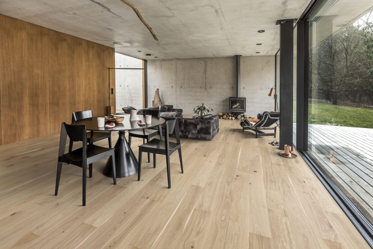 Decorated dining space with Kahrs Oak Eggshell Prefinished Hardwood.