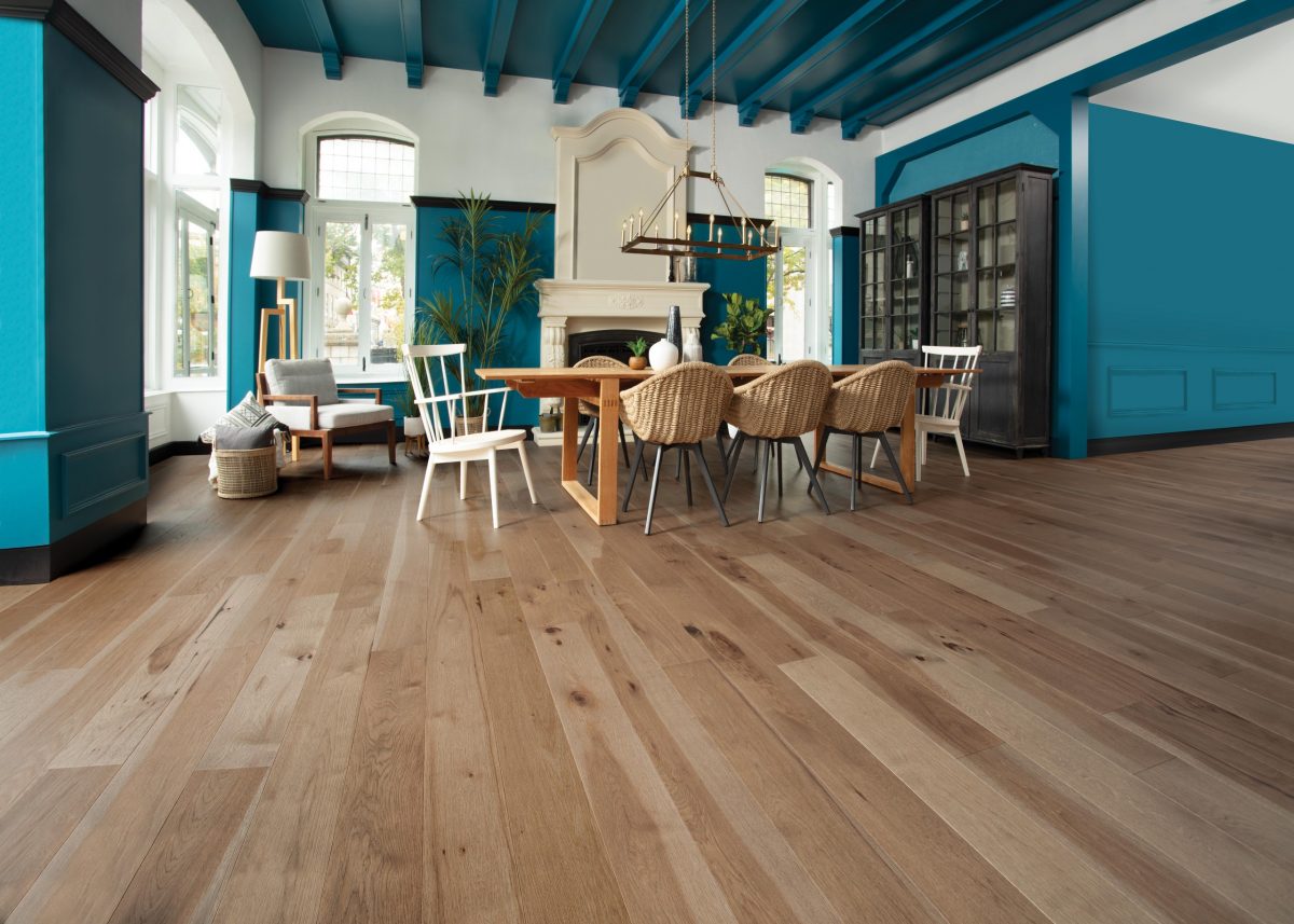 Decorated dining space with Mirage Hickory Clay Marbles Character Prefinished Hardwood.