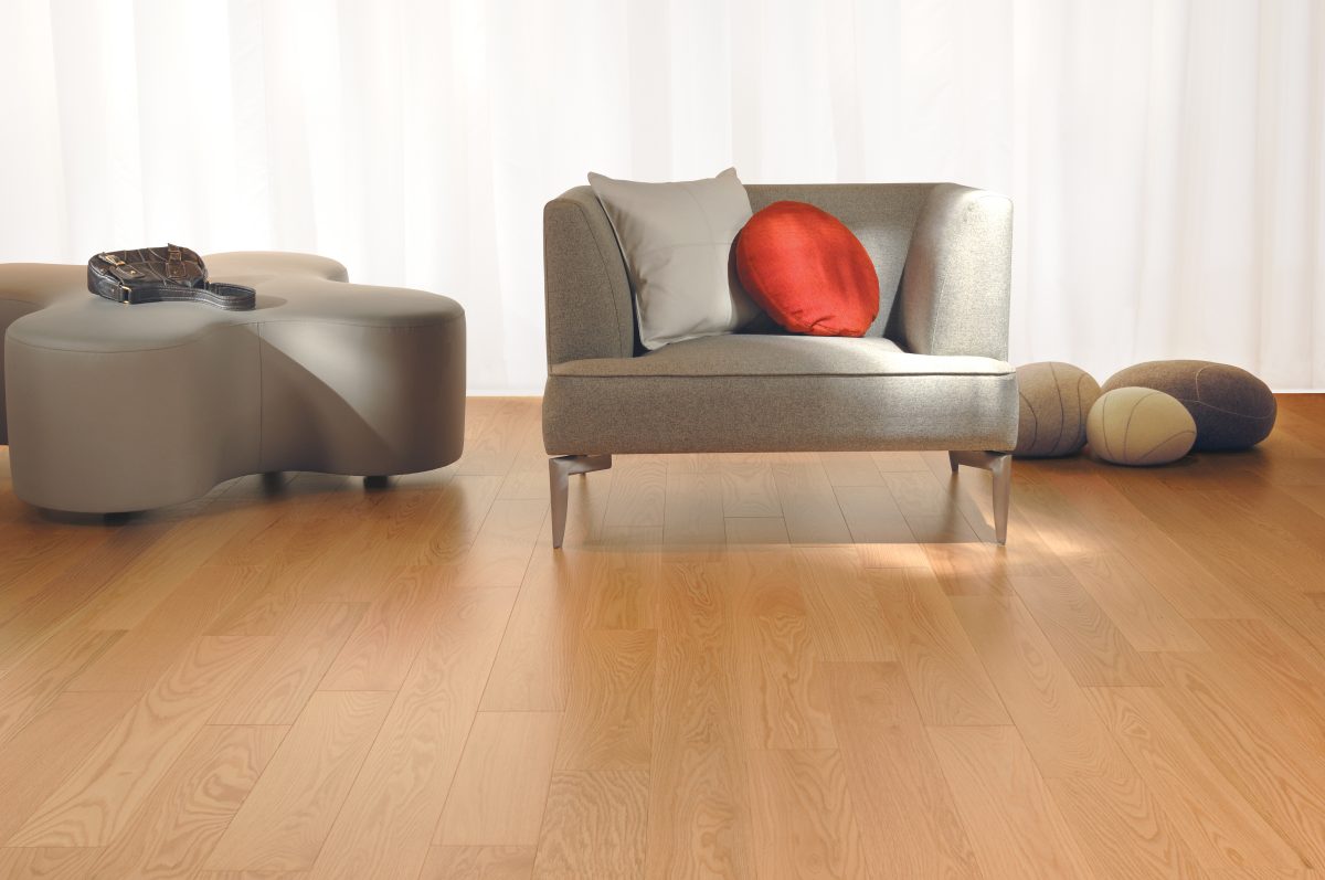 Decorated living room with Mirage Red Oak Natural Select and Better Smooth Prefinished Hardwood.