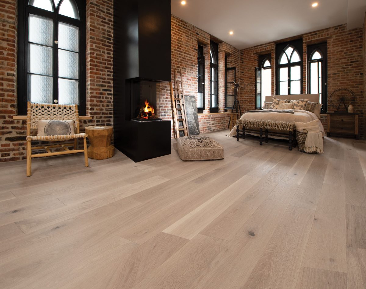 Decorated bedroom space with Mirage White Oak Carousel Character Brushed Prefinished Hardwood.