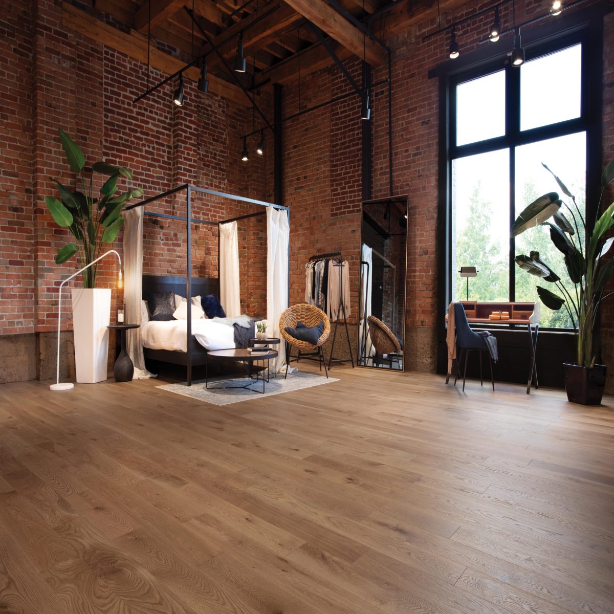 Decorated bedroom space with Mirage White Oak Jump Rope Character Brushed Prefinished Hardwood.