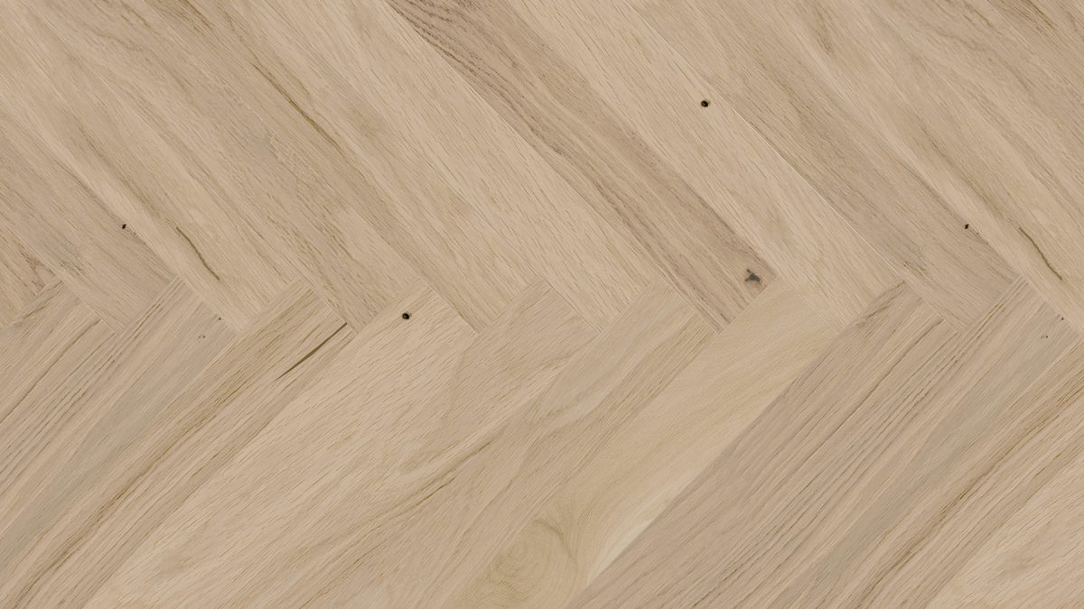 Close up of Barlinek Oak Balos Herringbone Prefinished Hardwood.