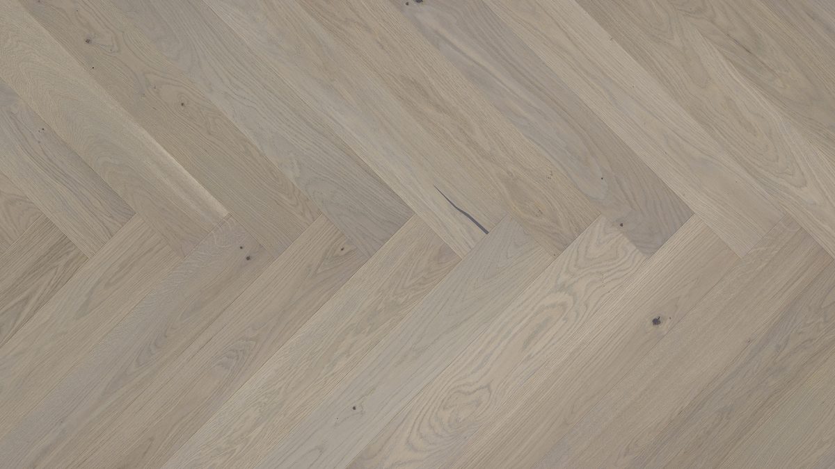 Close up of Barlinek Oak Marzipan Muffin Herringbone Prefinished Hardwood.