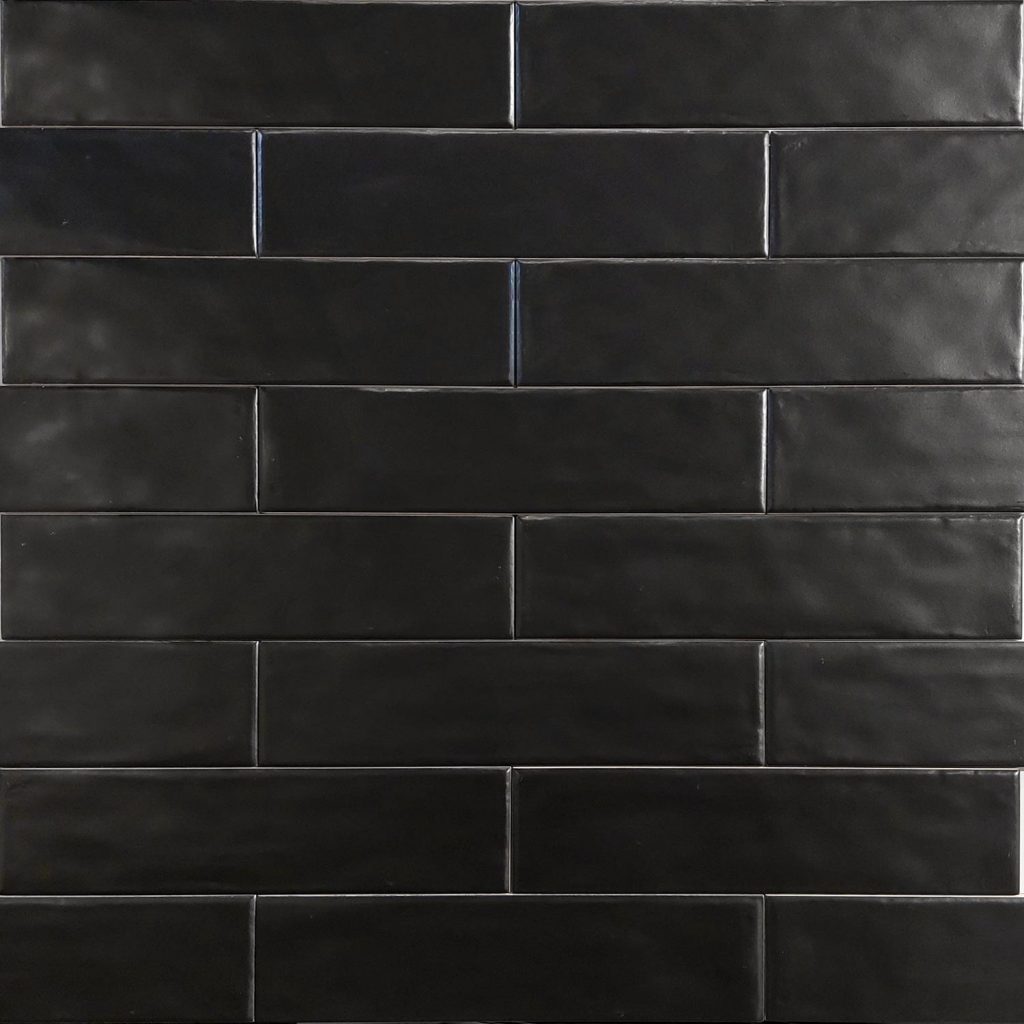 Close up of Equipe Cottage Black Matt Tiles And Stone.