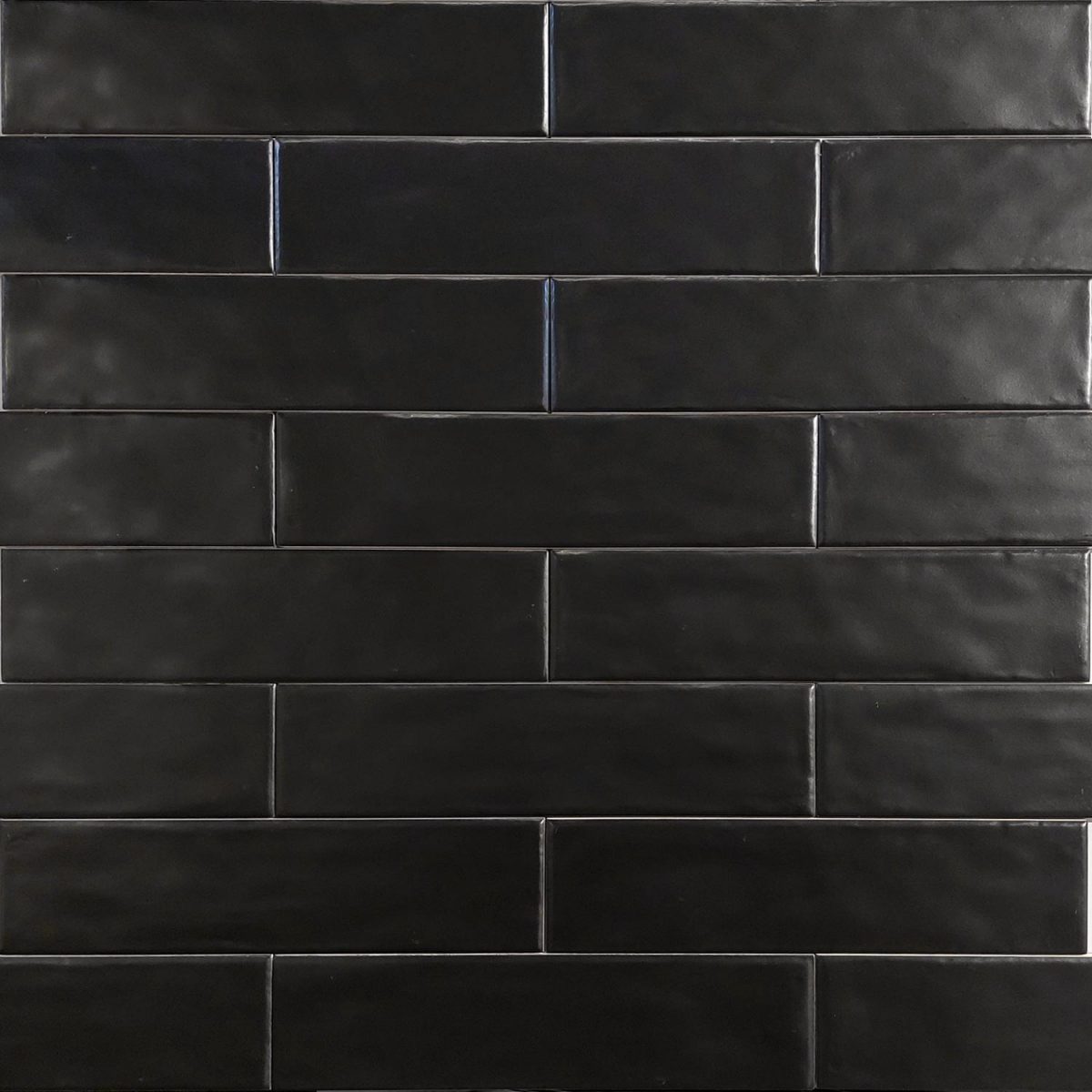 Close up of Equipe Cottage Black Matt Tiles And Stone.