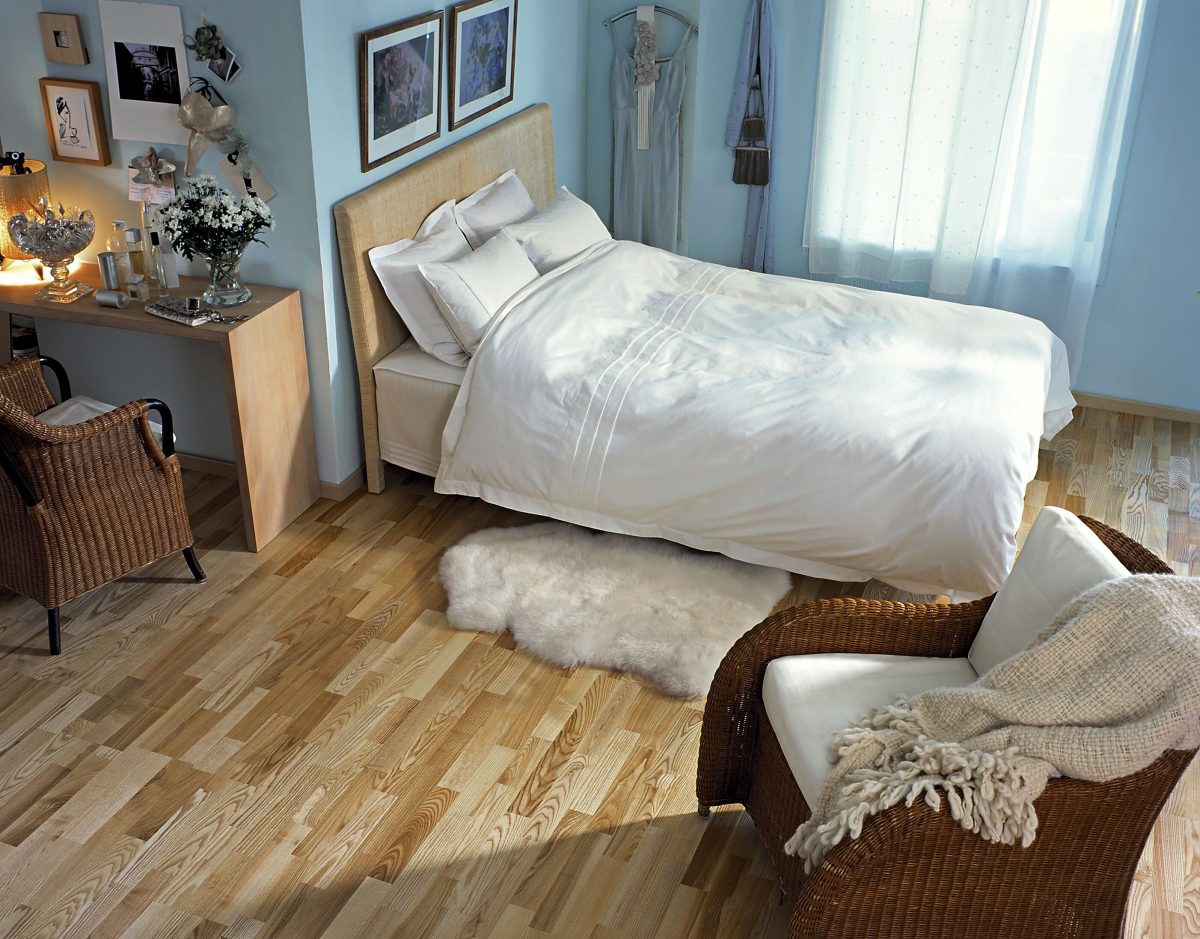 Decorated bedroom space with Kahrs Ash Vaila Prefinished Hardwood.