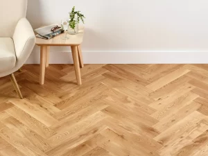 Indoor scenery of herringbone unfinished hardwood.